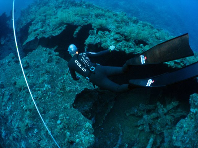 Freediver exploring the wreck of the Dunraven in the Red Sea, Egypt